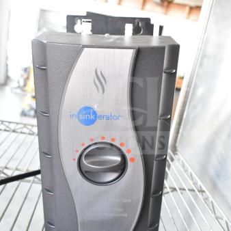 Insinkerator HWT Instant Hot Water Tank, 115 Volts, 1 Phase, black and stainless steel, on wire shelf.