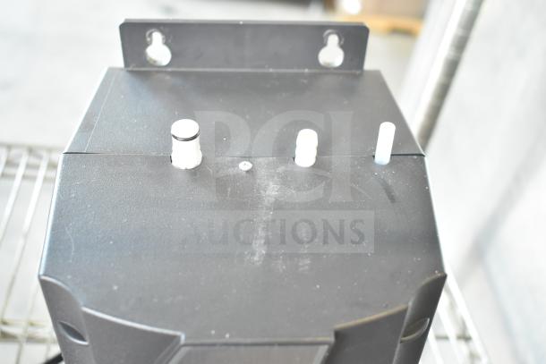 Insinkerator HWT Instant Hot Water Tank, 115V, 1 Phase, Black unit with visible pipe connections, in good condition.