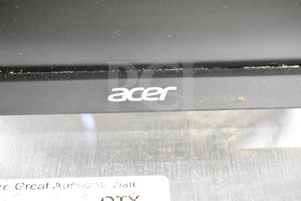 2 Acer monitors with NCR Kitchen Controller, visible Acer logo, slightly dusty condition, used for kitchen setups.