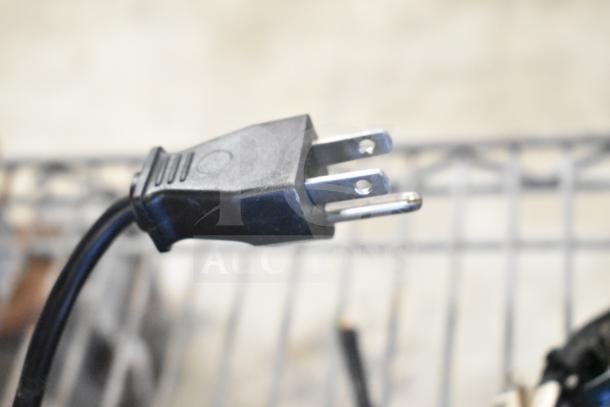 Power plug for Acer monitors and NCR Kitchen Controller, auction item. Key components for tech setup. Condition not visible.