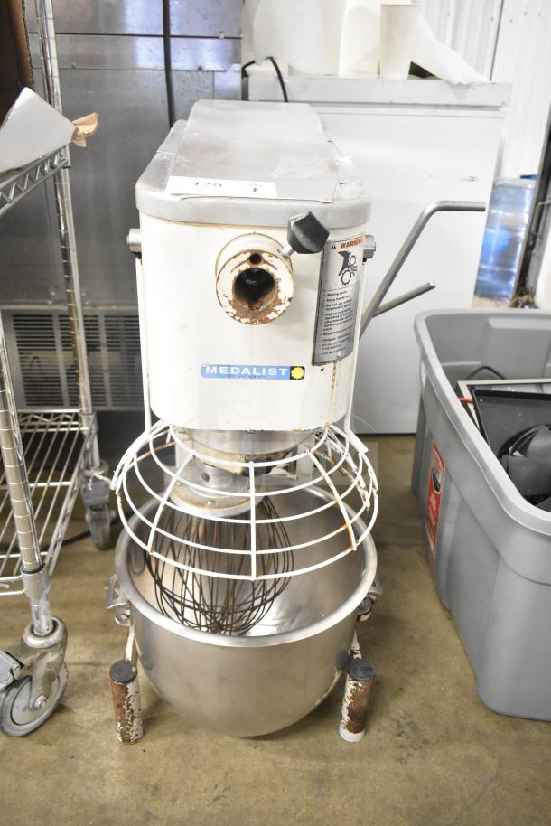 Medalist L20 commercial dough mixer with 20-quart bowl, bowl guard, and whisk attachment. 120V, used condition with visible wear.