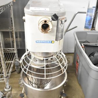 Medalist L20 commercial dough mixer with 20-quart bowl, bowl guard, and whisk attachment. 120V, used condition with visible wear.