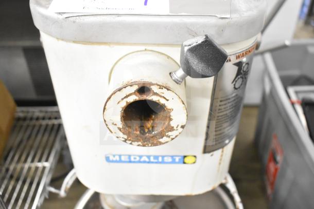 Medalist L20 Commercial 20 Quart Dough Mixer with visible bowl guard and whisk attachment. Shows wear on exterior. 120V.