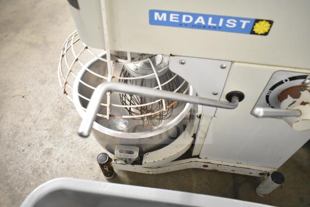 Medalist L20 commercial dough mixer with 20-quart bowl, bowl guard, and whisk attachment. 120V, 1 phase, visible branding.