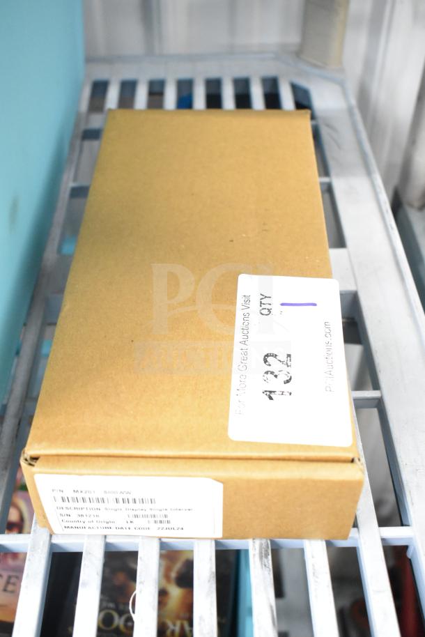 Cardboard box labeled MX201-SI00WW Single Display. Tags indicate description, part number, and manufacture date 22JUL24.