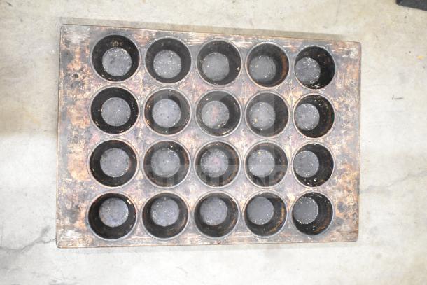 14-slot vintage muffin baking pan, worn condition, metallic finish. Part of 14-item lot with mesh baking pans.