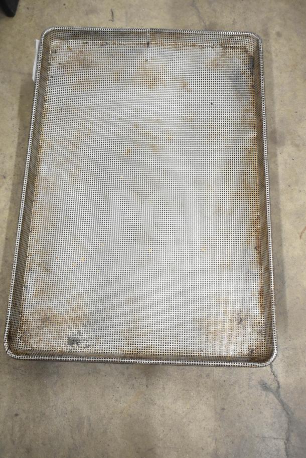 Mesh baking pan, rectangular, used condition with visible wear. Part of a set of 14 assorted baking items.