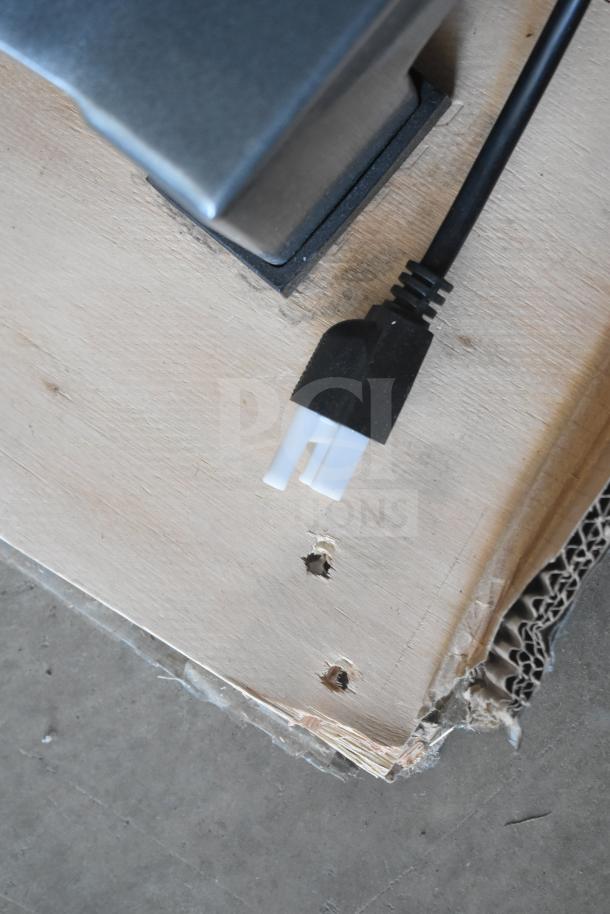 Avantco MX10H planetary dough mixer plug detail. Black cord on wood surface. 120V, 1 phase, scratch and dent condition.