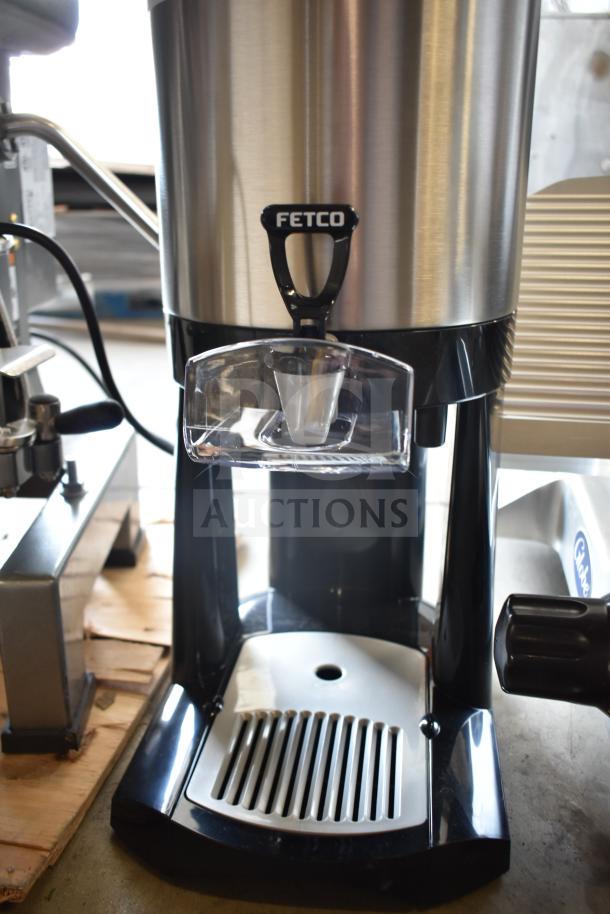 BRAND NEW SCRATCH AND DENT! Fetco L4D-15 Luxus 1.5 Gallon Stainless Steel Coffee Server with Stand, visible Fetco logo.