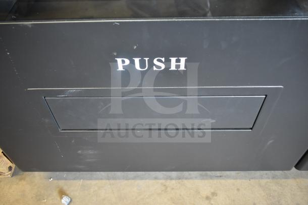 BRAND NEW SCRATCH AND DENT 2025 KoolMore KM-VMNT-50-BR snack vending machine, black, "PUSH" label, 115 volts, 1 phase.