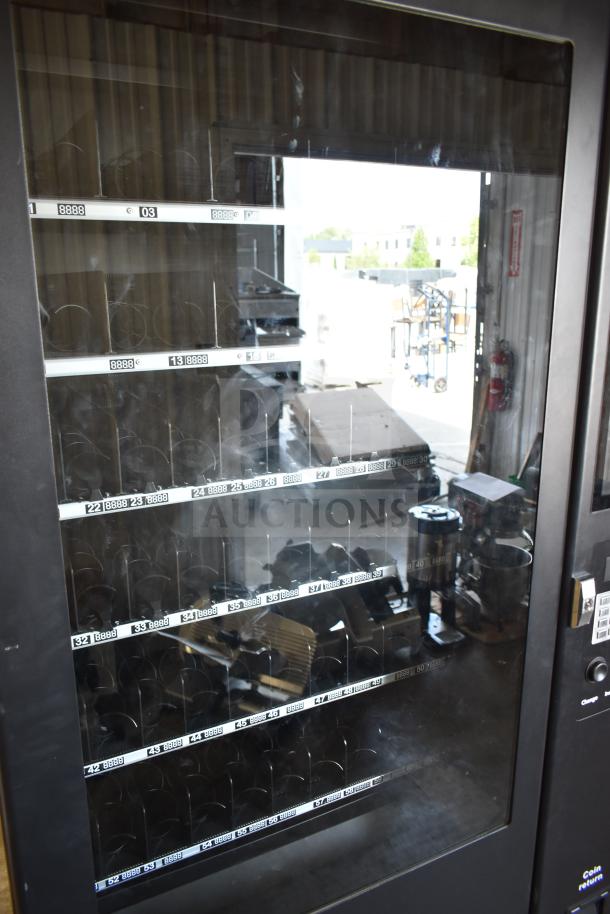 Brand new 2025 KoolMore KM-VMNT-50-BR snack vending machine, 115 volts, minor scratches, visible item slots, keypad.