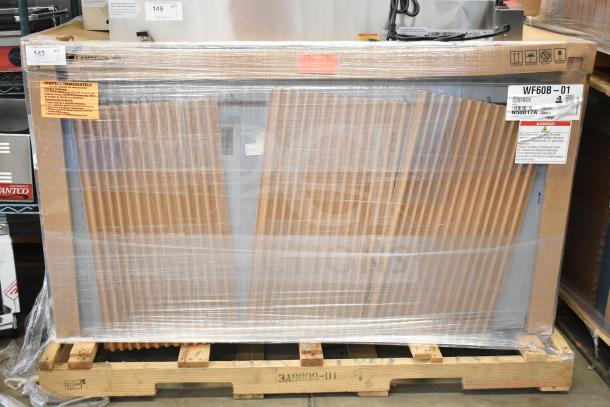 Brand new 2023 Hoshizaki WF60B-01 60" commercial worktop freezer in packaging, scratch and dent condition. Model label visible.