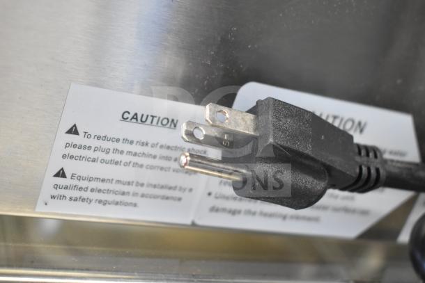 Avantco 177BMFW3 electric bain marie food warmer plug with caution label visible, emphasizing safety instructions.
