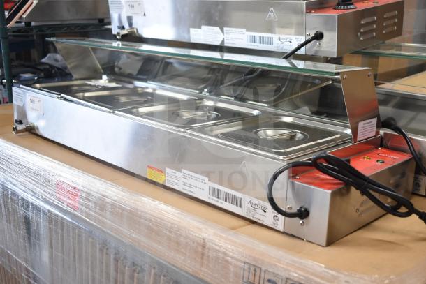 Brand new Avantco 177BMFW4 46" electric bain marie warmer with 4 half-size wells, glass cover, tags, and labeling visible.