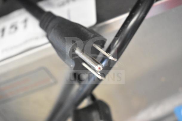 Avantco model 184THD1800 commercial toaster power cord plug, close-up. New condition despite scratch and dent.