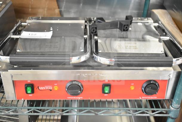 BRAND NEW Avantco 177PG400S Panini Grill, dual smooth plates, 19 5/8"x9 1/8" cooking surface, 120V, 1 Phase, minor scratches.