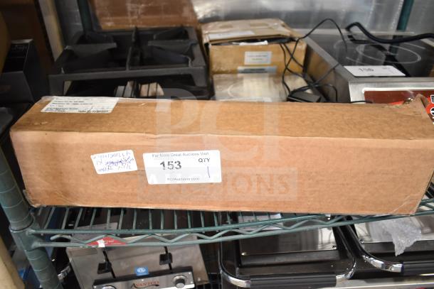 Brown box containing a brand new Manitowoc AR-10000P Arctic Pure Plus Ice Machine Water Filtration System, .5 Micron, 0.75 GPM.
