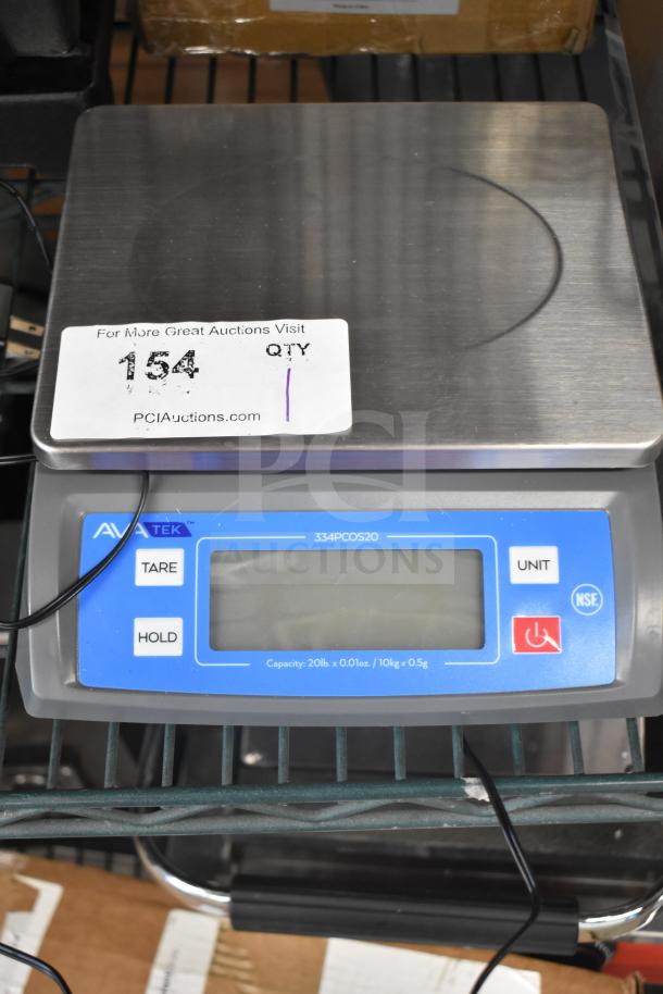 BRAND NEW AvaTek 334PCOS20 digital portion control scale, 20 lb. capacity, slight scratch, tare and hold functions visible.
