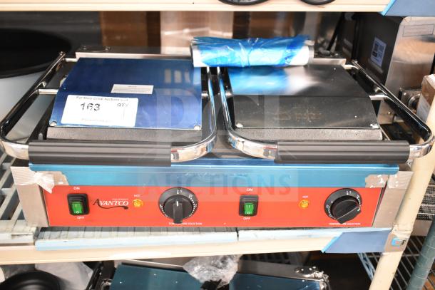 Brand new Avantco 177PG400S dual panini grill, 19 5/8" x 9 1/8" cooking area, smooth plates, minor surface blemishes.