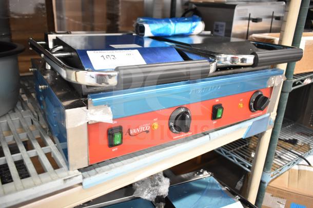 Brand new Avantco 177PG400S commercial dual panini grill, smooth plates, 19 5/8" x 9 1/8" surface, 120V, 1 phase, scratch and dent.
