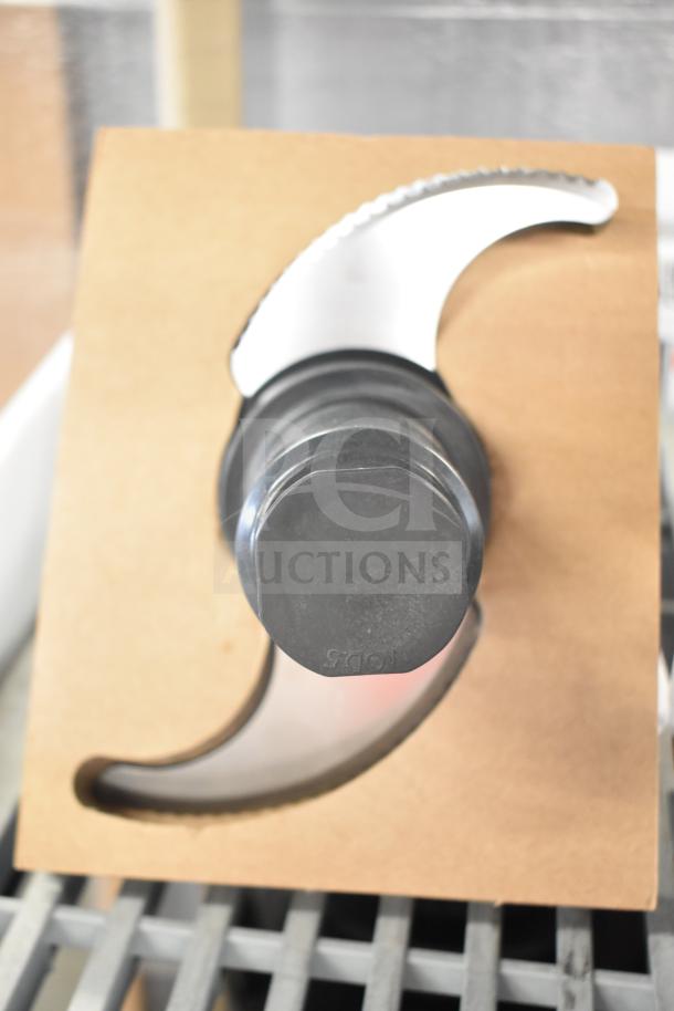 Waring WFP14S1 S Blade, brand new with minor scratches, in cardboard packaging, black base, serrated metal blade.