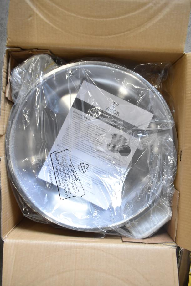 Box containing six brand new Vigor SS1 Series 12 Qt. stainless steel braziers with aluminum-clad bottoms and covers.