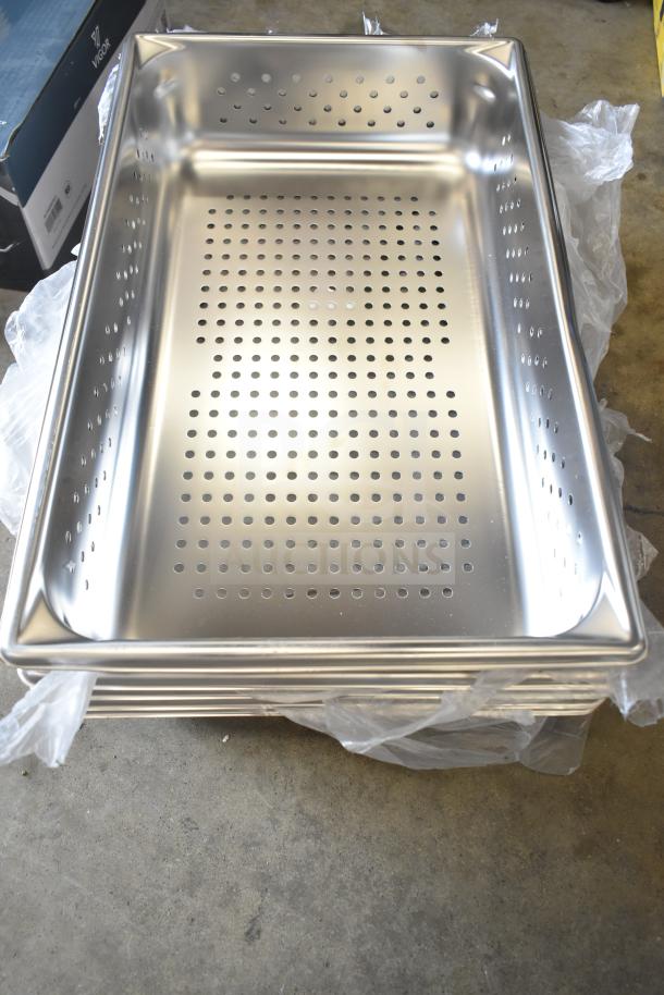 6 brand new perforated stainless steel drop-in bins, scratch and dent, stacked with protective packaging.
