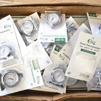 Box with 17 Choice 2" Dial Oven Thermometers, model 9142DOT, and a 12-Cup Baker's Lane Muffin Pan, brand new condition.