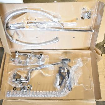 Brand new 190PRW812 wall-mounted pre-rinse faucet, 8" centers, 12" add-on, chrome finish, minor scratches, in original packaging.