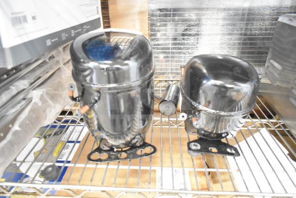 2 brand new Avantco compressors, models 17816586 & 17817638, 115V, R290, stored on metal shelf, scratch and dent condition.