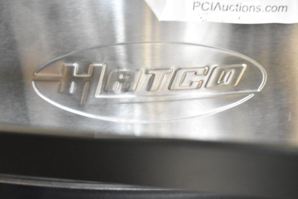 Hatco TPT-208 logo detail on stainless steel. Brand new, scratch and dent 4-slice commercial toaster with 1 1/4" slots.