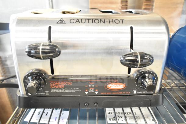 Brand new Hatco TPT-208 commercial 4-slice toaster with 1 1/4" slots. 208 volts, 1 phase. "Caution-Hot" label visible.