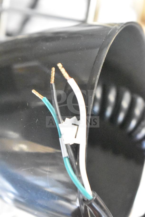 Brand new ServIt HLR85BK heat lamp, black finish dome, retractable cord, 120V, 1 phase, visible wiring, minor scratches.