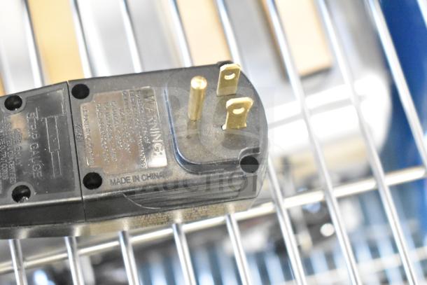 Close-up of the plug for a Galaxy 177GLXYGW electric glass washer, showing "Made in China" label. Item is brand new.