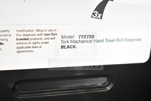 BRAND NEW Tork 772728 Black Mechanical Paper Towel Dispenser H71, slight scratch and dent, with label showing model and brand.