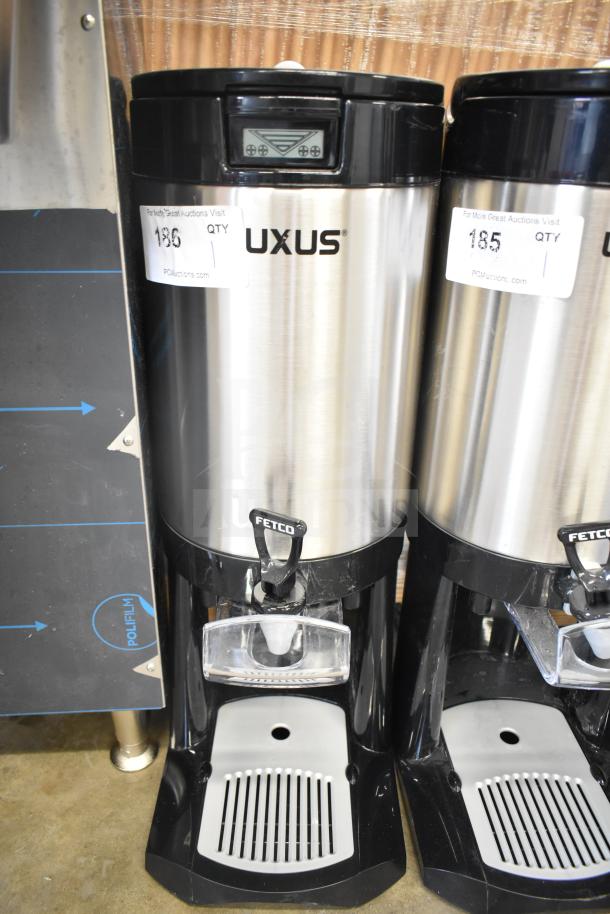 BRAND NEW Fetco L4D-20 Luxus 2 Gallon Stainless Steel Coffee Server with Stand, minor scratch and dent. Tags visible.