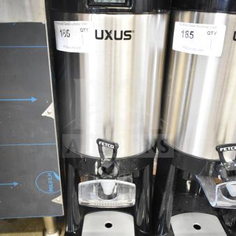 BRAND NEW Fetco L4D-20 Luxus 2 Gallon Stainless Steel Coffee Server with Stand, minor scratch and dent. Tags visible.