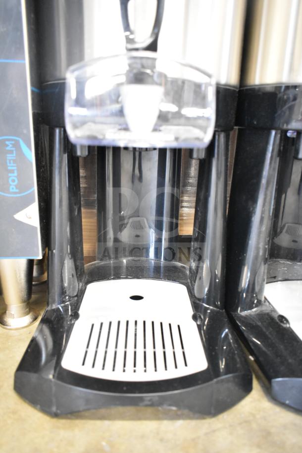 BRAND NEW SCRATCH AND DENT! Fetco L4D-20 Luxus 2 Gallon Stainless Steel Coffee Server with Stand, protective film visible.