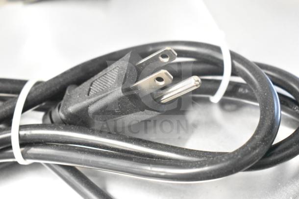 Black power cord for Vollrath 40955 SLP330E/S meat slicer, tied with a white cable tie, shown on a white background.