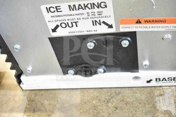 BRAND NEW 2026 Manitowoc IYP0600A-161 commercial ice machine, details on ice making and water connections visible.
