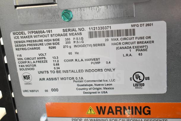 Label on Manitowoc IYP0600A-161 ice machine showing model, serial number, specs, and safety certifications.
