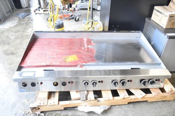 Brand new Garland GTGG60-GT60M 60" liquid propane griddle with thermostatic controls, 140,000 BTU, minor scratches.
