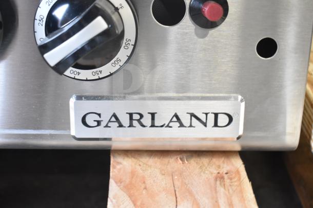 Brand new Garland GTGG60-GT60M 60" propane griddle with thermostatic controls, 140,000 BTU, slight scratches.