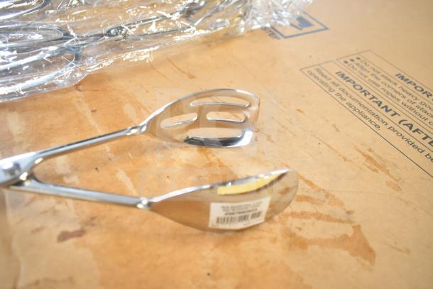 Stainless steel slotted serving spoon with barcode label, part of 6 scratch and dent items, new condition.