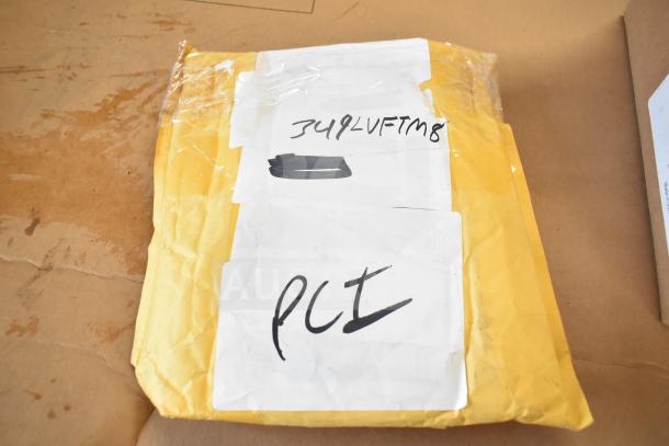 Yellow package labeled "349LVFTM8" contains six new scratch and dent items, including Lancaster Table & Seating M8 table foot.