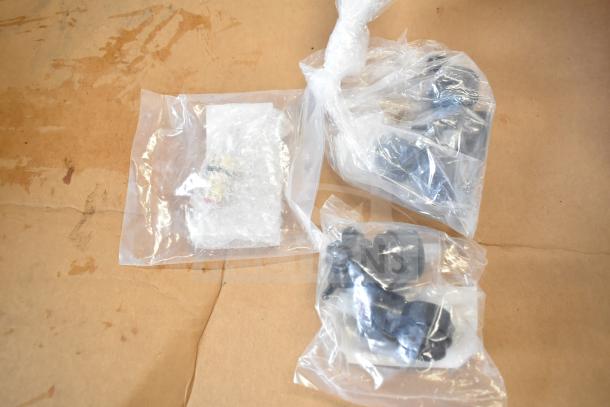 6 brand new scratch and dent items in plastic bags, including Lancaster self-adjusting table feet and Zicam products.