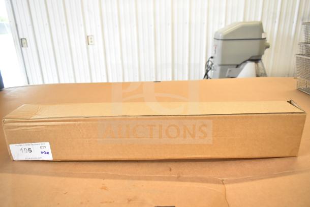 Brown cardboard box containing items including Dorman Vapor Can Vent Valve 911-239 and Acopa Keystone Porcelain Saucers.