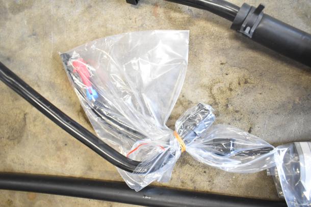 Brand new Dorman Vapor Can Vent Valve 911-239, sealed in a clear plastic bag, on a concrete surface.