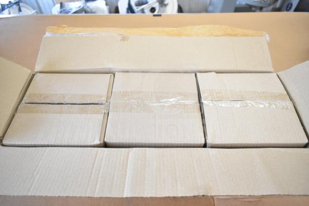 Cardboard boxes containing new items, including Dorman Vapor Can Vent Valve 911-239 and Acopa Keystone Porcelain Saucers, visible.