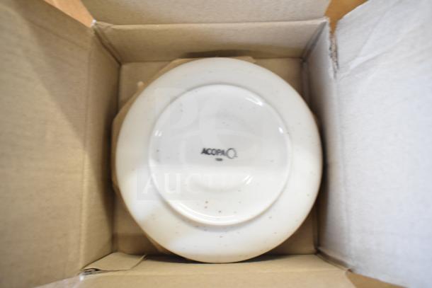 Acopa Keystone 6.5" Vanilla Bean Porcelain Saucer, brand new, in box, featuring speckled design and Acopa logo.
